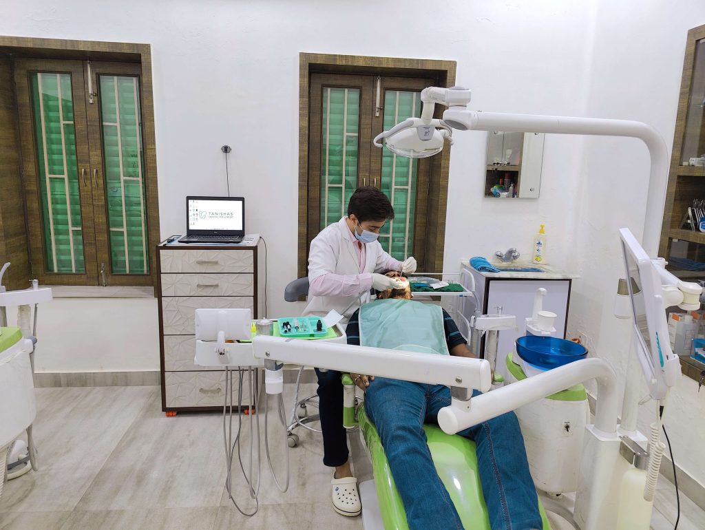 dentist working at dental clinic dentist working at dental clinic